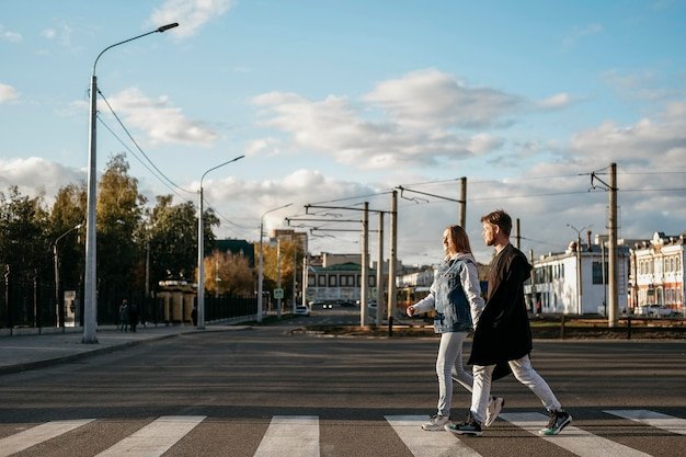Side view of couple on a walk in the city